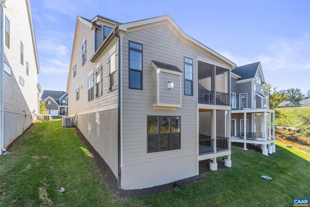 196 Thicket Run Pl, Charlottesville, VA 22911 - rear view of property featuring central AC unit, a balcony, and a lawn