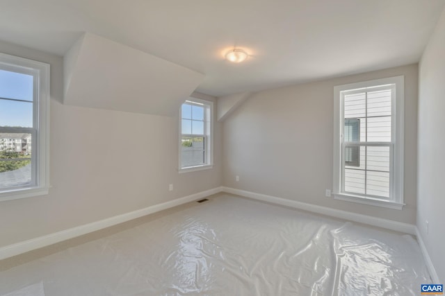 196 Thicket Run Pl, Charlottesville, VA 22911 - bonus room featuring light colored carpet, visible vents, baseboards, and vaulted ceiling