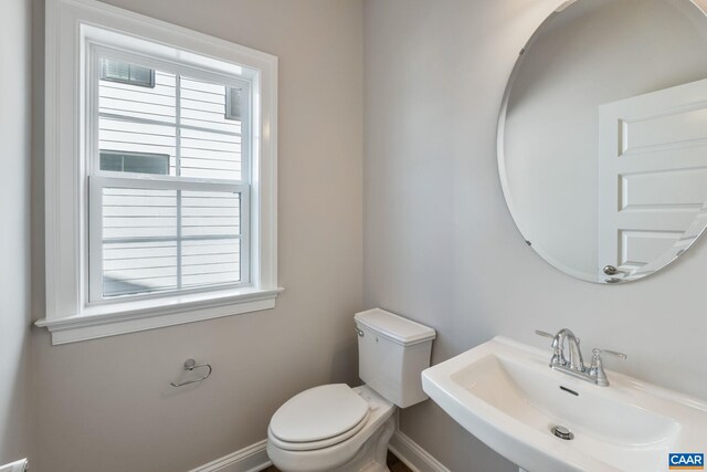 196 Thicket Run Pl, Charlottesville, VA 22911 - half bath featuring a sink, toilet, baseboards, and a healthy amount of sunlight