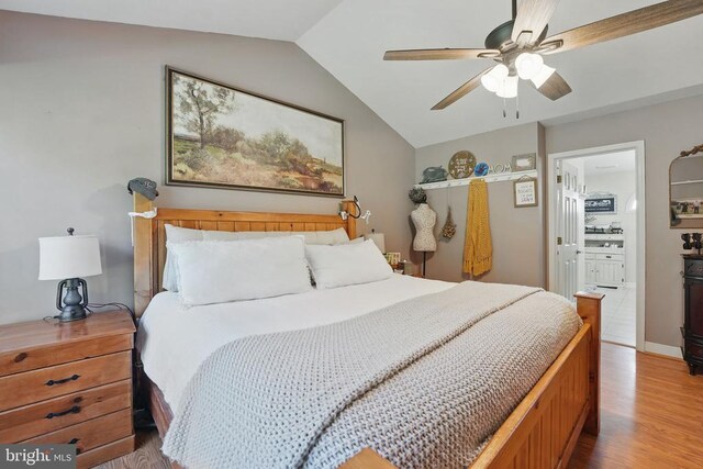 7329 Cloverhill Rd, Spotsylvania, VA 22551 - bedroom with vaulted ceiling, wood finished floors, ensuite bathroom, and a ceiling fan