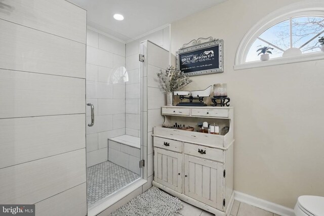 7329 Cloverhill Rd, Spotsylvania, VA 22551 - full bath featuring a stall shower, tile patterned floors, toilet, and baseboards