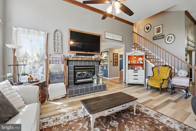 7329 Cloverhill Rd, Spotsylvania, VA 22551 - living room featuring wood finished floors, ceiling fan, stairway, a fireplace, and ornamental molding