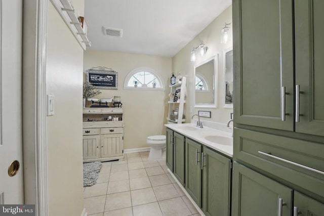 7329 Cloverhill Rd, Spotsylvania, VA 22551 - bathroom with toilet, tile patterned floors, double vanity, and baseboards