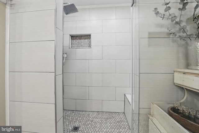 7329 Cloverhill Rd, Spotsylvania, VA 22551 - bathroom with a tile shower, crown molding, and tile patterned flooring