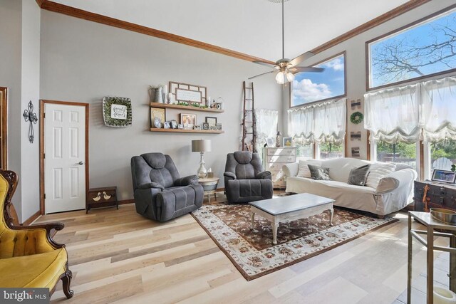7329 Cloverhill Rd, Spotsylvania, VA 22551 - living room featuring crown molding, a towering ceiling, wood finished floors, a ceiling fan, and baseboards