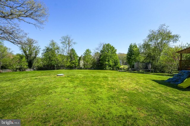 7329 Cloverhill Rd, Spotsylvania, VA 22551 - view of green lawn with a trampoline