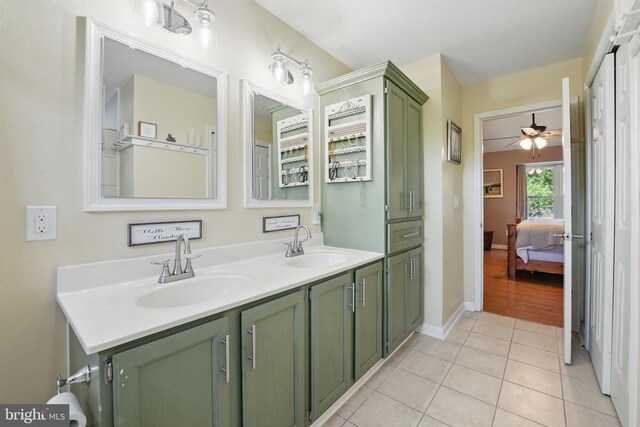 7329 Cloverhill Rd, Spotsylvania, VA 22551 - bathroom featuring tile patterned floors, ceiling fan, double vanity, baseboards, and connected bathroom