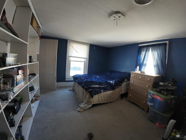 bedroom featuring light colored carpet