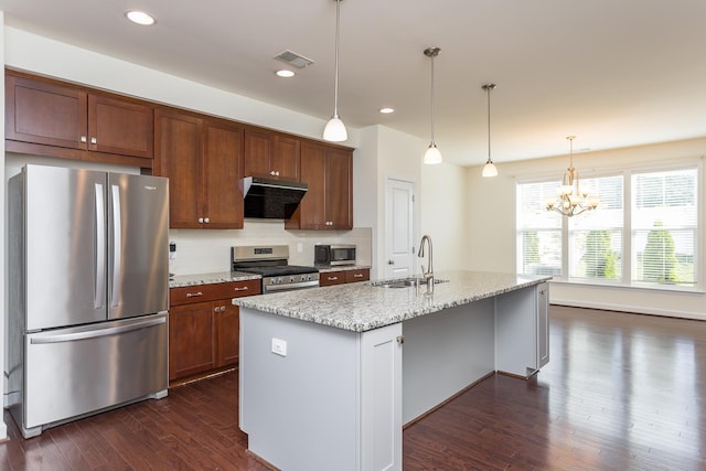 3267 Battery Park Pl, Rockingham, VA 22801 - kitchen with appliances with stainless steel finishes, dark wood-style flooring, range hood, a chandelier, and light stone countertops