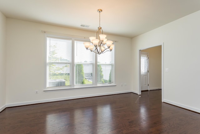 3267 Battery Park Pl, Rockingham, VA 22801 - spare room with a chandelier, healthy amount of natural light, and dark wood-type flooring
