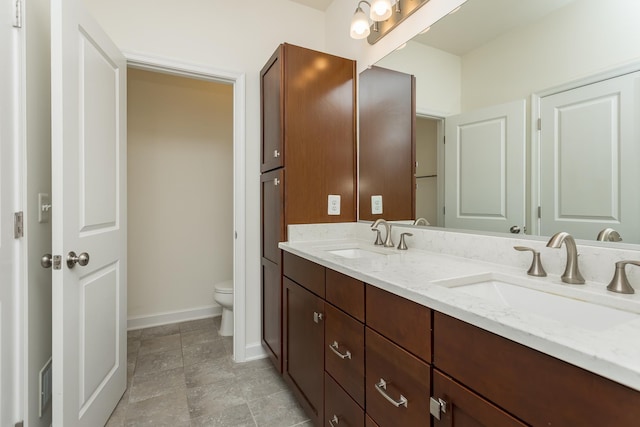 3267 Battery Park Pl, Rockingham, VA 22801 - bathroom featuring double vanity and toilet