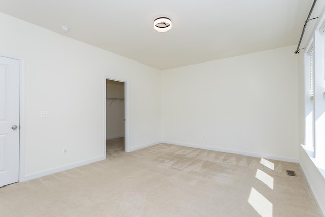 3267 Battery Park Pl, Rockingham, VA 22801 - unfurnished bedroom with light colored carpet, a spacious closet, and a closet
