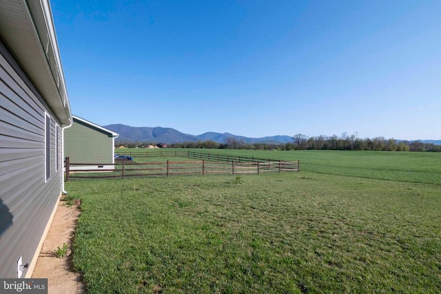 view of yard featuring a view of rural / pastoral area and a mountain view