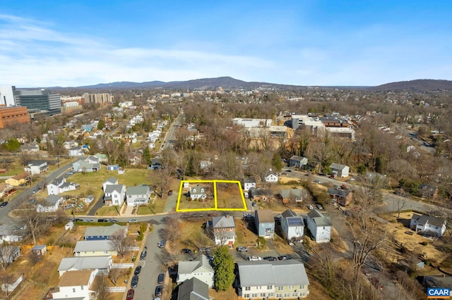 drone / aerial view with a residential view and a mountain view
