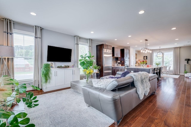 3436 Charleston Blvd, Rockingham, VA 22801 - living area with an inviting chandelier, dark wood-type flooring, and recessed lighting