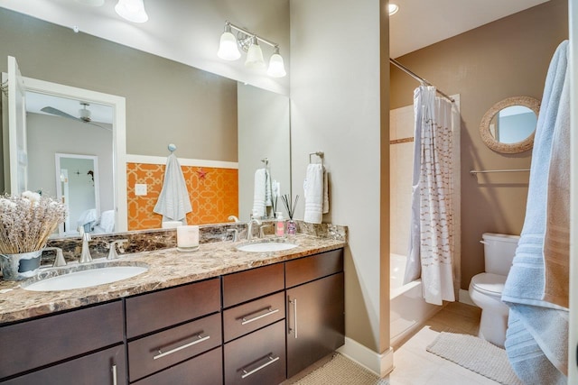3436 Charleston Blvd, Rockingham, VA 22801 - full bathroom featuring toilet, tile patterned floors, double vanity, and a sink