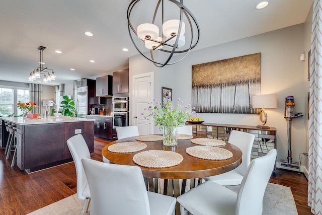 3436 Charleston Blvd, Rockingham, VA 22801 - dining area featuring a notable chandelier, dark wood-style floors, and recessed lighting