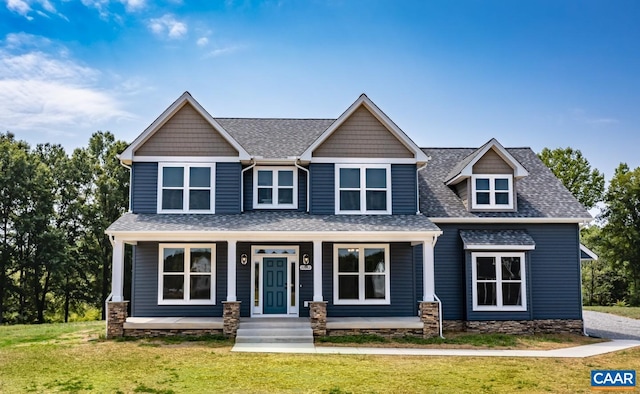 craftsman house featuring a front yard and a porch