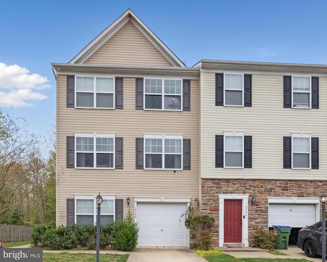 2348 Silver Fox Way, Locust Grove, VA 22508 - view of property with an attached garage, stone siding, and concrete driveway