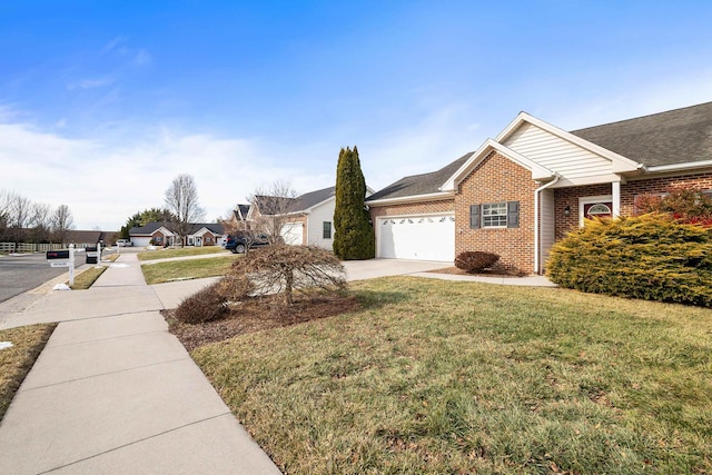 43 Greenview Ln, New Market, VA 22844 - exterior space with a yard, driveway, brick siding, and an attached garage
