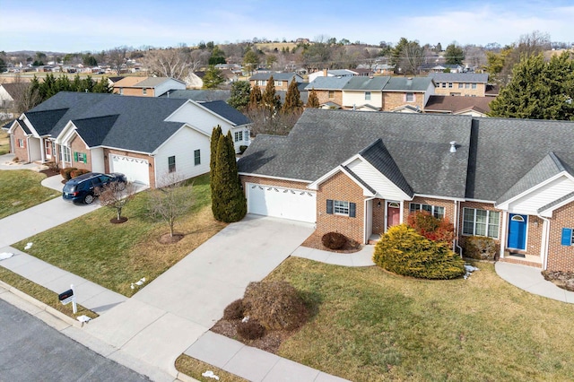 43 Greenview Ln, New Market, VA 22844 - view of front facade featuring an attached garage, a residential view, concrete driveway, a front lawn, and brick siding