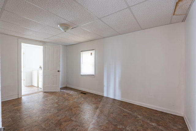 822 Beverley St W, Staunton, VA 24401 - empty room with baseboards, washer / dryer, and a drop ceiling