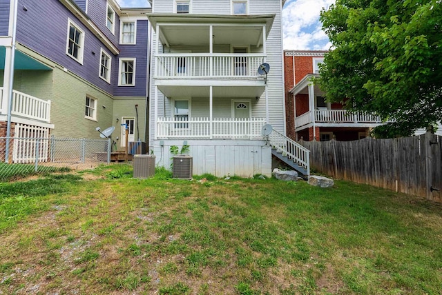 822 Beverley St W, Staunton, VA 24401 - back of property with cooling unit, a yard, stairway, and a fenced backyard