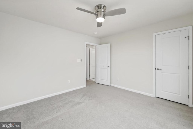 unfurnished bedroom with carpet floors, baseboards, and a ceiling fan