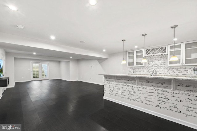 kitchen with white cabinetry, backsplash, glass insert cabinets, and recessed lighting