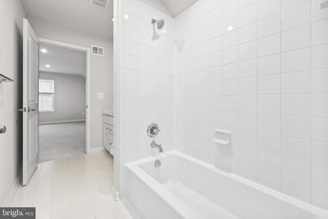 full bath featuring tile patterned floors, bathing tub / shower combination, vanity, and visible vents