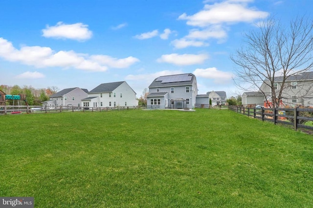 view of yard with a residential view and a fenced backyard