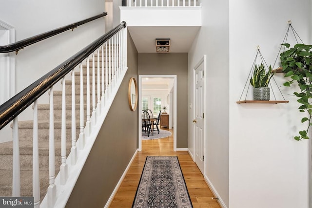 5915 Copper Mountain Dr W, Spotsylvania, VA 22553 - hallway with stairway and wood finished floors