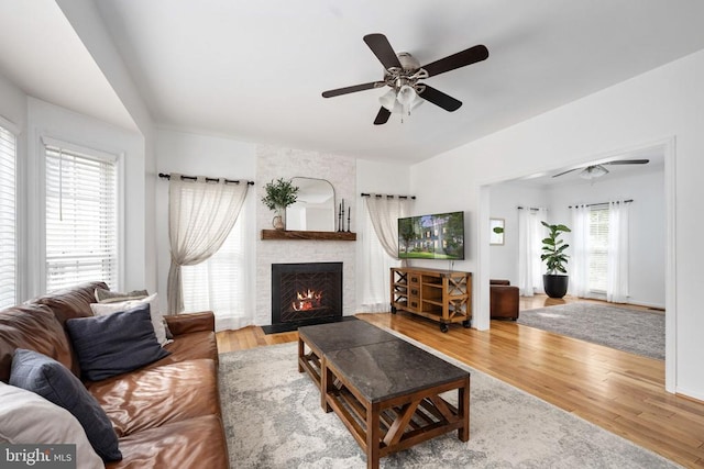5915 Copper Mountain Dr W, Spotsylvania, VA 22553 - living area featuring a fireplace, ceiling fan, and wood finished floors