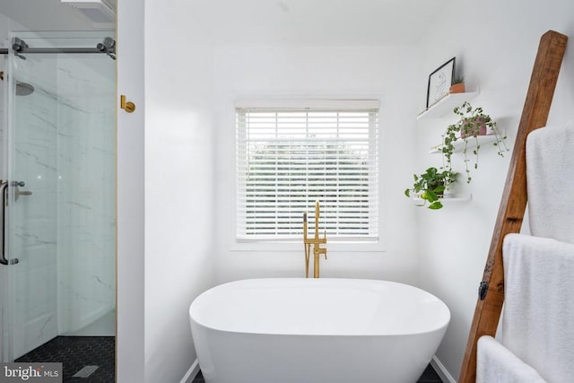 5915 Copper Mountain Dr W, Spotsylvania, VA 22553 - full bath with a freestanding bath and a marble finish shower