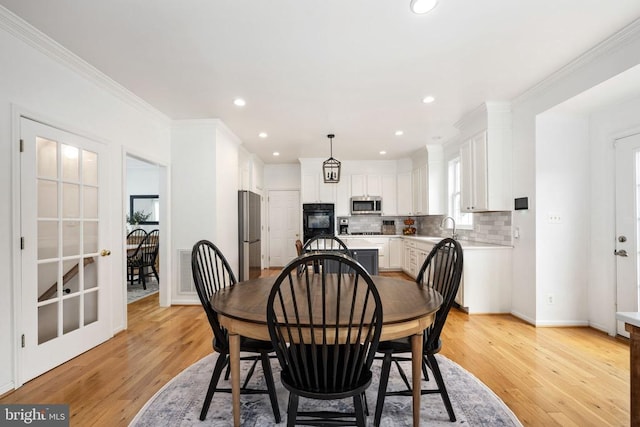 5915 Copper Mountain Dr W, Spotsylvania, VA 22553 - dining area featuring light wood-type flooring, ornamental molding, and recessed lighting