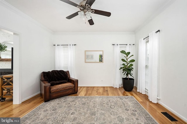 5915 Copper Mountain Dr W, Spotsylvania, VA 22553 - sitting room featuring wood finished floors, plenty of natural light, ornamental molding, and a ceiling fan