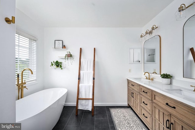 5915 Copper Mountain Dr W, Spotsylvania, VA 22553 - bathroom with double vanity, a freestanding bath, and tile patterned flooring