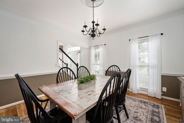 5915 Copper Mountain Dr W, Spotsylvania, VA 22553 - dining space with a chandelier, plenty of natural light, crown molding, wood finished floors, and stairway