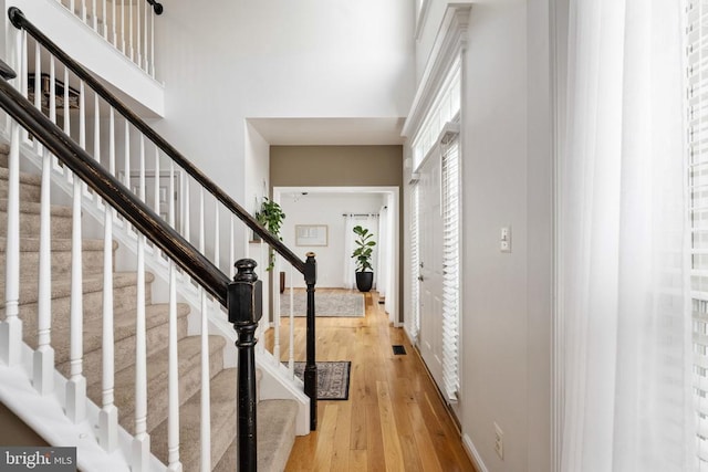 5915 Copper Mountain Dr W, Spotsylvania, VA 22553 - foyer entrance featuring a high ceiling, light wood-type flooring, and stairs