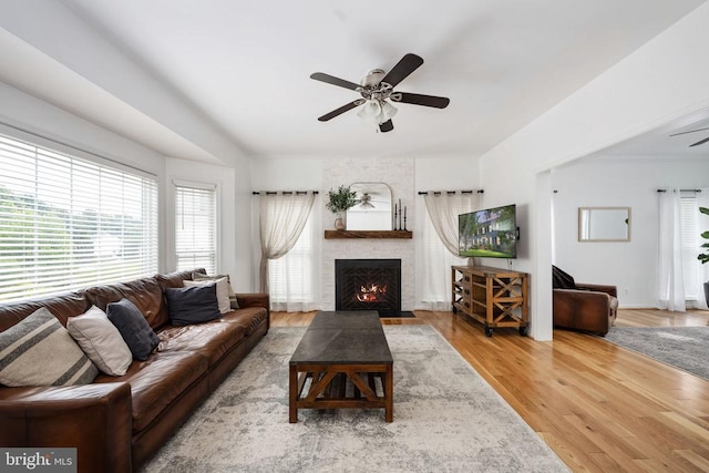 5915 Copper Mountain Dr W, Spotsylvania, VA 22553 - living room featuring a ceiling fan, a fireplace, and wood finished floors