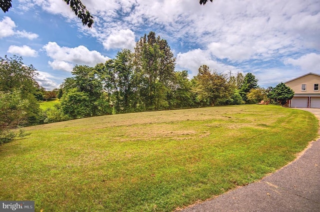 18691 Springs Rd, Jeffersonton, VA 22724 - view of green lawn with a garage
