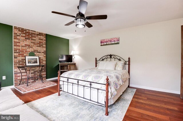 18691 Springs Rd, Jeffersonton, VA 22724 - bedroom with wood finished floors, ceiling fan, and a fireplace