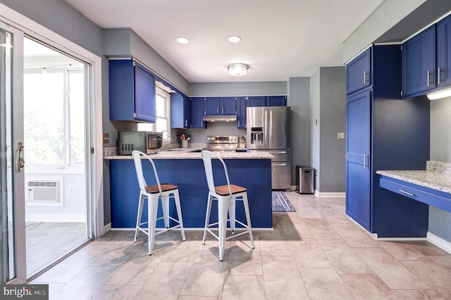 18691 Springs Rd, Jeffersonton, VA 22724 - kitchen with appliances with stainless steel finishes, blue cabinetry, a peninsula, under cabinet range hood, and recessed lighting
