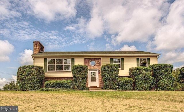 18691 Springs Rd, Jeffersonton, VA 22724 - raised ranch with a chimney, a front lawn, brick siding, and entry steps