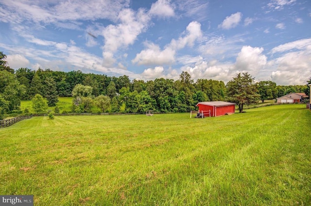 18691 Springs Rd, Jeffersonton, VA 22724 - view of green lawn featuring a pole building, an outdoor structure, and a view of rural / pastoral area