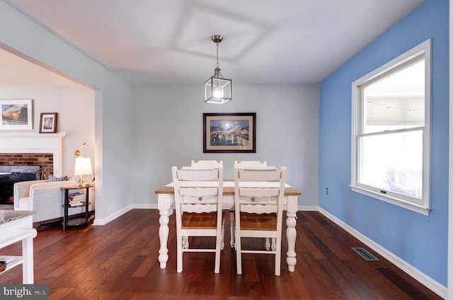 18691 Springs Rd, Jeffersonton, VA 22724 - dining room featuring dark wood-type flooring and a fireplace