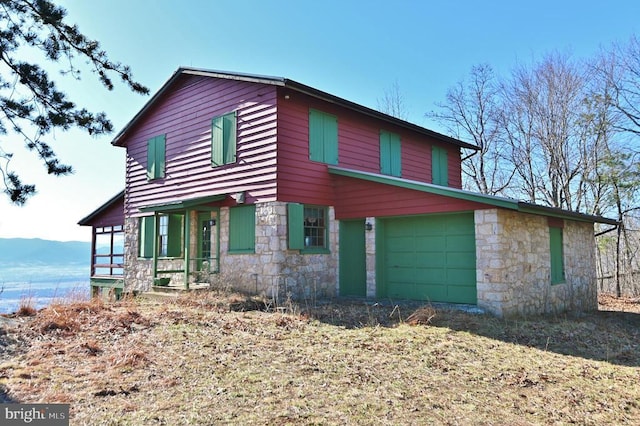 301 Mountain Top Dr, Luray, VA 22835 - view of front of house with stone siding, an attached garage, and a mountain view