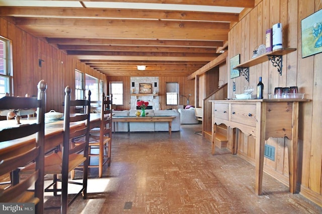 301 Mountain Top Dr, Luray, VA 22835 - kitchen featuring wood walls, beam ceiling, and dark flooring