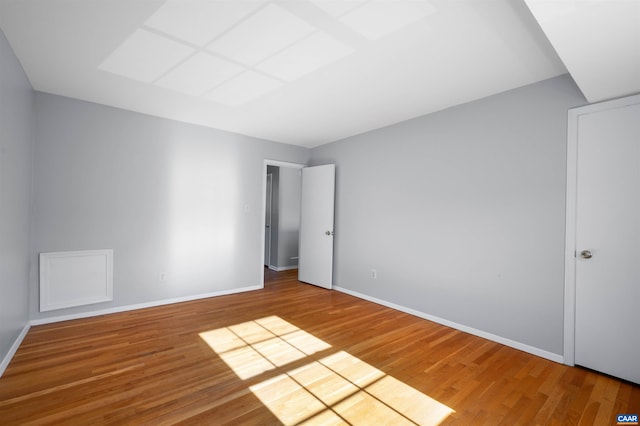 unfurnished bedroom featuring baseboards and wood finished floors