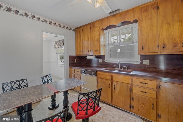 101 Deerwood Rd, Charlottesville, VA 22911 - kitchen with white dishwasher, dark countertops, and plenty of natural light
